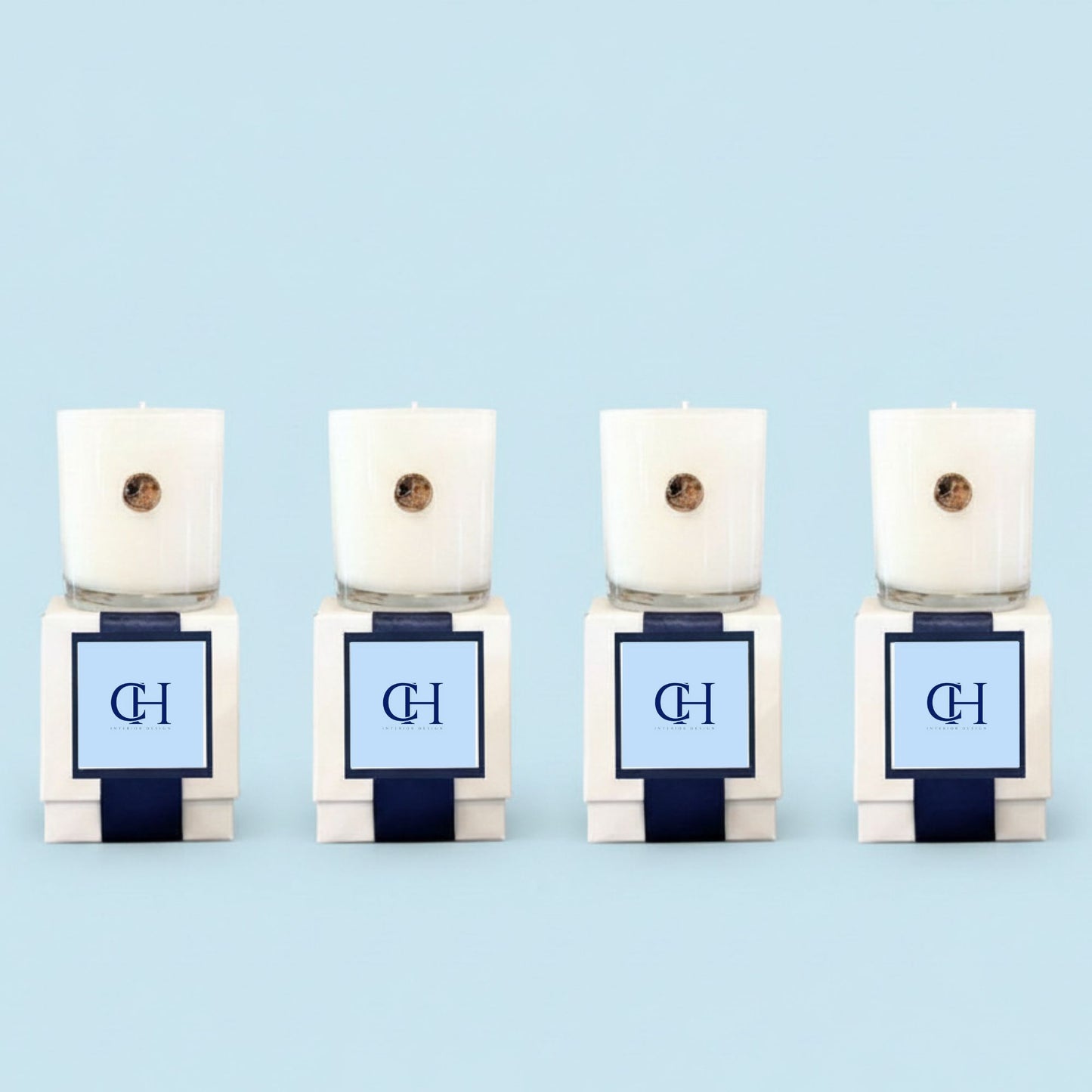 Set of four custom branded corporate candles with matching monogram logos on luxury white gift boxes, North Carolina made executive gifts