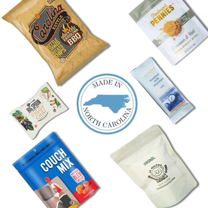 Contents of Handpicked NC corporate event welcome box including Carolina-made snacks and sweets