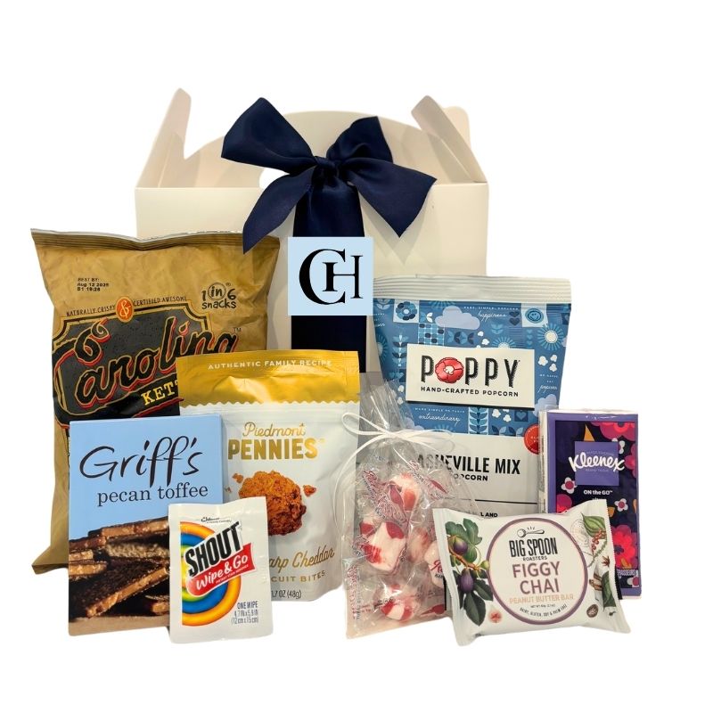 North Carolina wedding welcome box with monogrammed label, filled with locally made snacks and guest essentials, perfect for out-of-town wedding guests