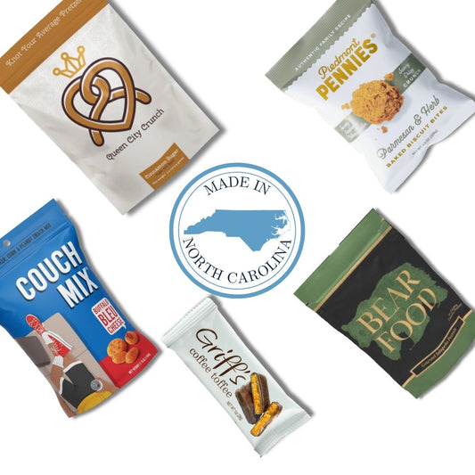 Gourmet items that are made in North and South Carolina in a flat lay around an emblem of the Carolinas