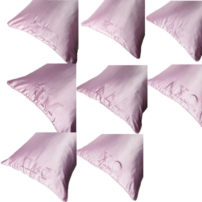 Pink satin pillowcase with embroidered sorority letters