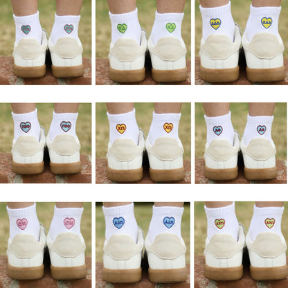 White ankle socks with embroidered sorority letters in heart design