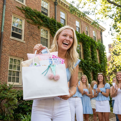 UNC Chapel Hill bid day gift bag hand-delivered to sorority new member on campus