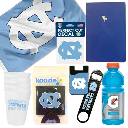 UNC fan gift basket contents with GDTBATH cups, Tar Heels accessories, and Chapel Hill spirit items