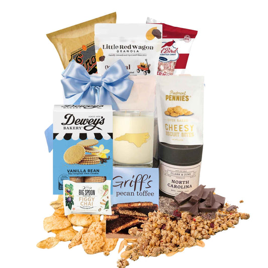 Jute gift bag filled with made in North Carolia products such as cookies, chips, and a candle. Great welcome gift for anyone moving to or visiting North Carolina